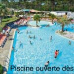 Piscine extérieure avec bassins et transats au camping Au Viviers Siblu sublime bungalow