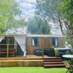 Terrasse en bois avec salon extérieur dans le Bisca wifi, plage, piscines à 2 pas, 6 pers avec Vayny