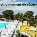 Piscine avec toboggan et transats au Camping Parc des 7 Fonts