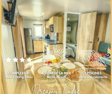 Intérieur avec kitchenette coin repas et lit dans le Dreamy Lodge