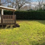 Jardin avec terrasse en bois du Mobil Home 6 à 8 personnes avec jardin