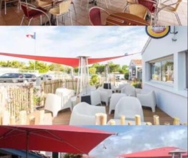 Terrasse extérieure avec tables et parasols au Mobile home Sol a gogo